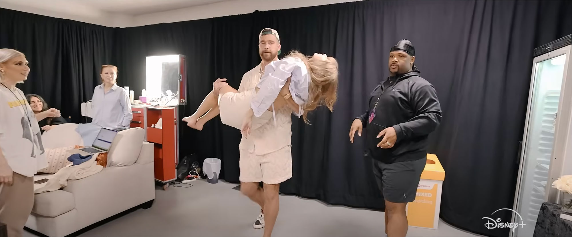 Travis Kelce and Taylor Swift Kiss Backstage in New 'Eras Tour' Doc Teaser
