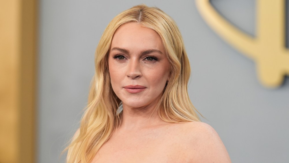 Lindsay Lohan Wears These Exact Comfy White Sneakers on Set