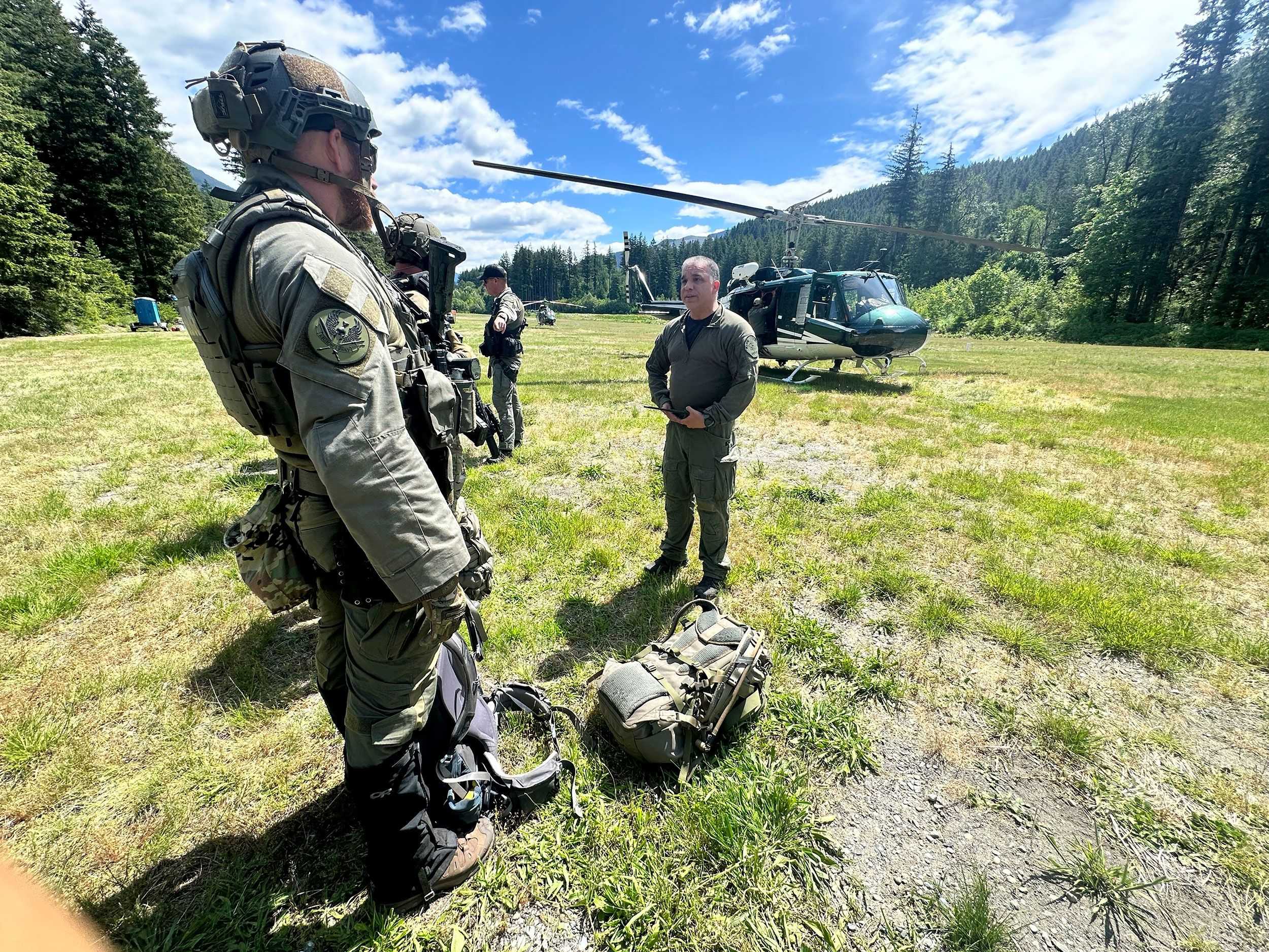Search for man accused of killing his daughters intensifies in the Cascades as summer visitors flock to the area