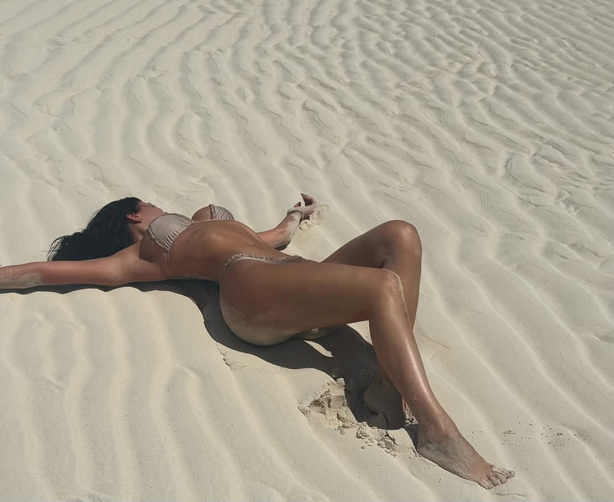 Kylie Jenner Poses in Sand in Tan-Colored Bikini on Vacation: 'DND'