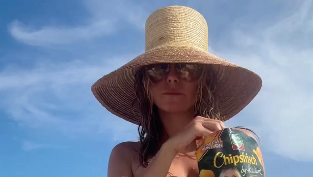 Heidi Klum Goes Topless at the Beach While Posing in Thong Bikini Bottoms