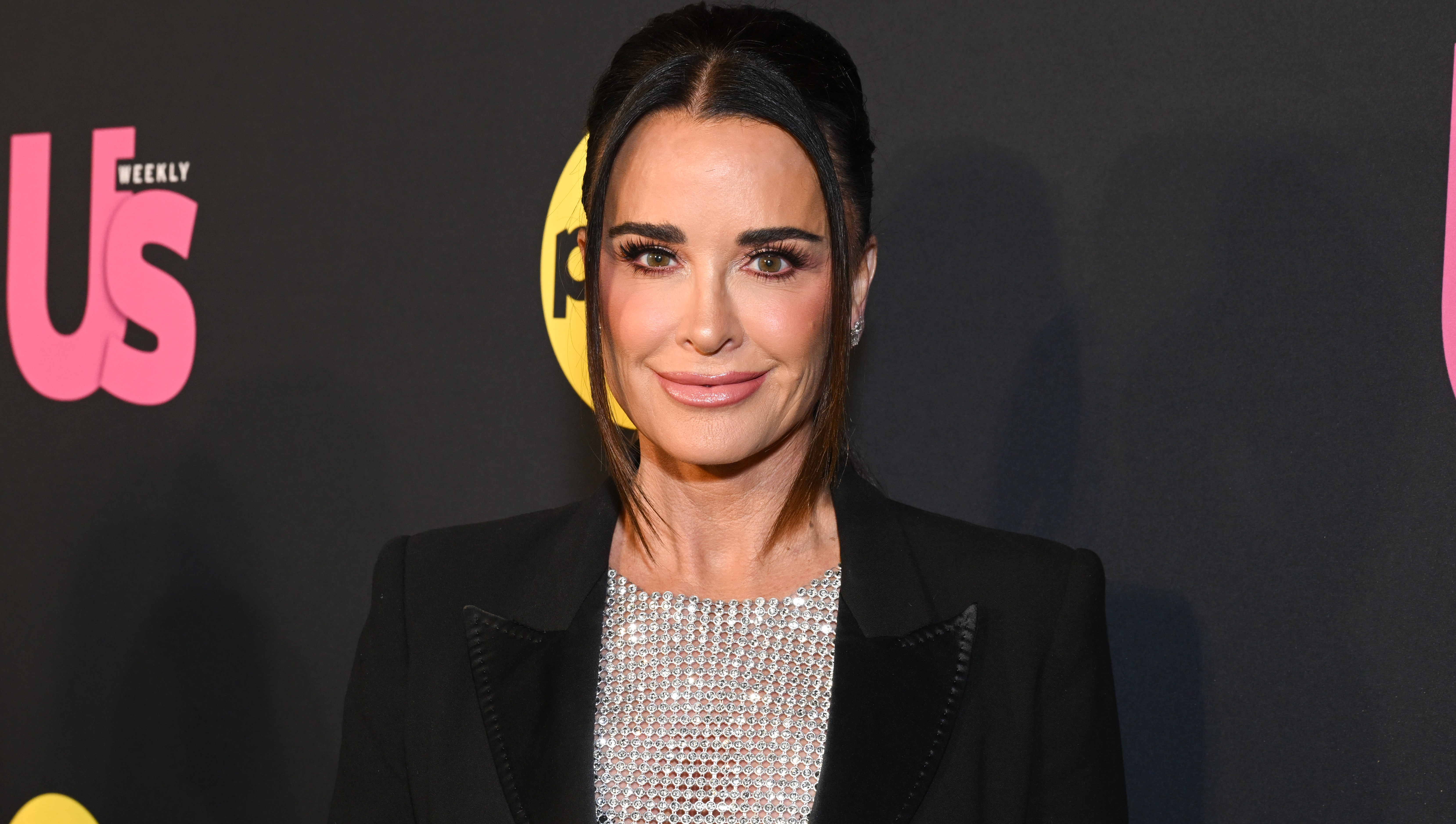 Kyle Richards’ Flared Black Pants Made Her Petite Frame Look Seriously Leggy