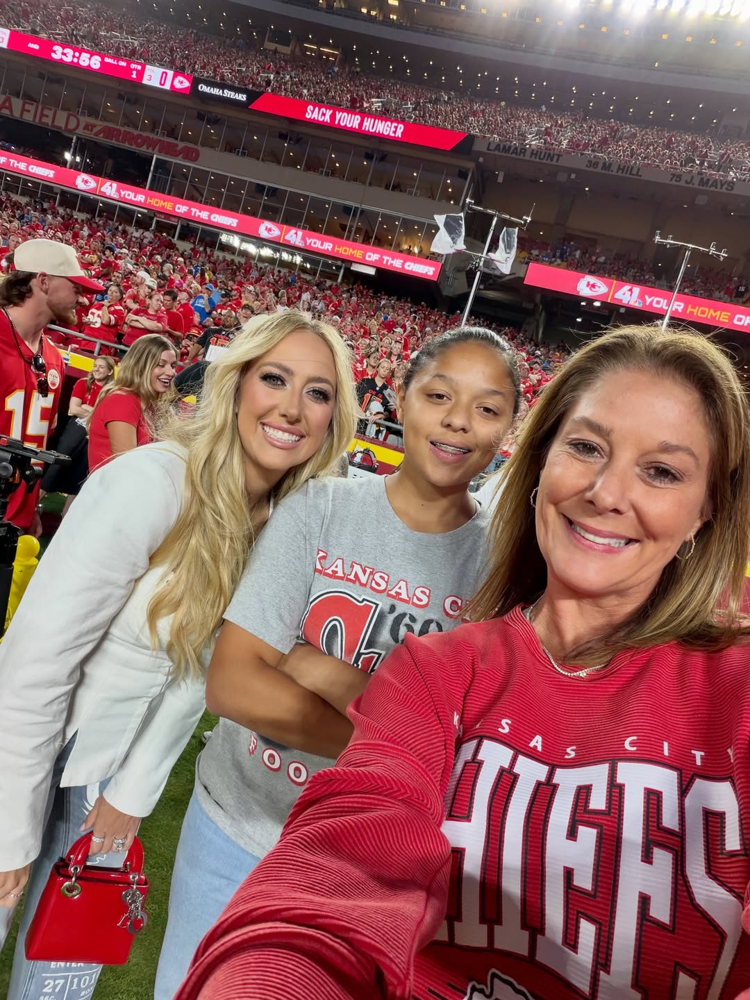 Brittany Mahomes Rocks White Shirt and Denim While Kissing Patrick Mahomes