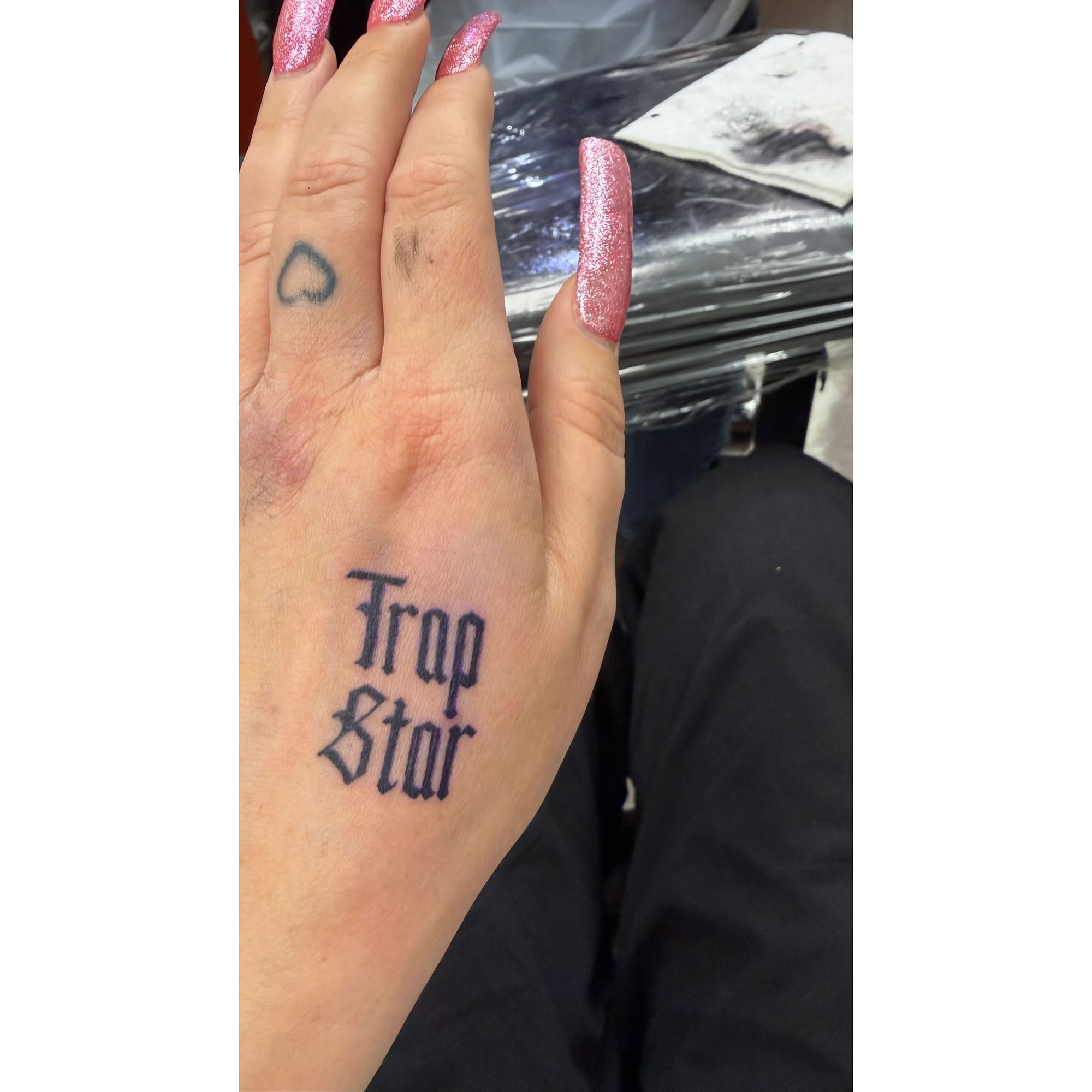 Amanda Bynes Shows Off New 'Trap Star' Hand Tattoo as She Wears Blue Lipstick