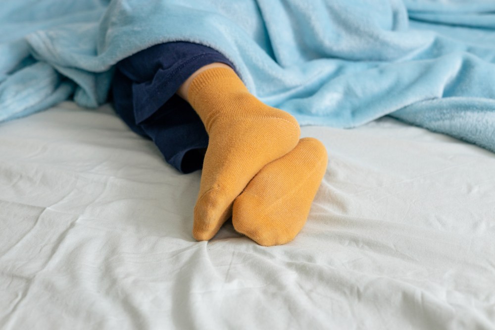 Should You Be Sleeping With Socks On? Doctors Have a Surprising Answer